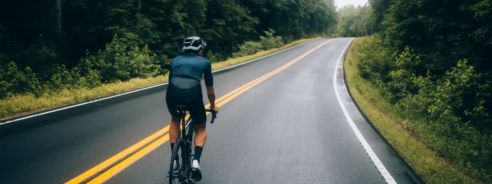 cyclist-man-riding-bike-road